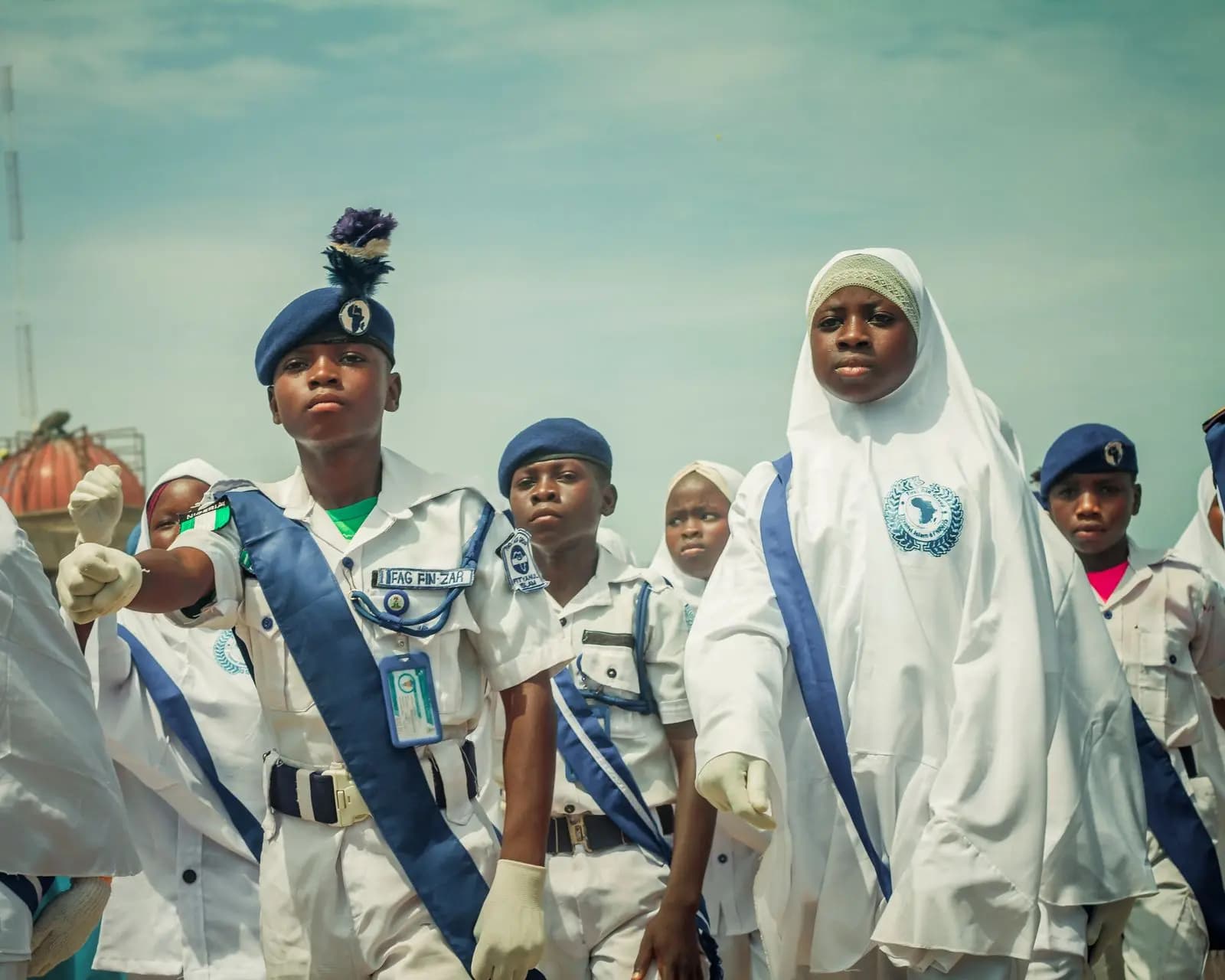 Pupils in uniform marching in a school parade