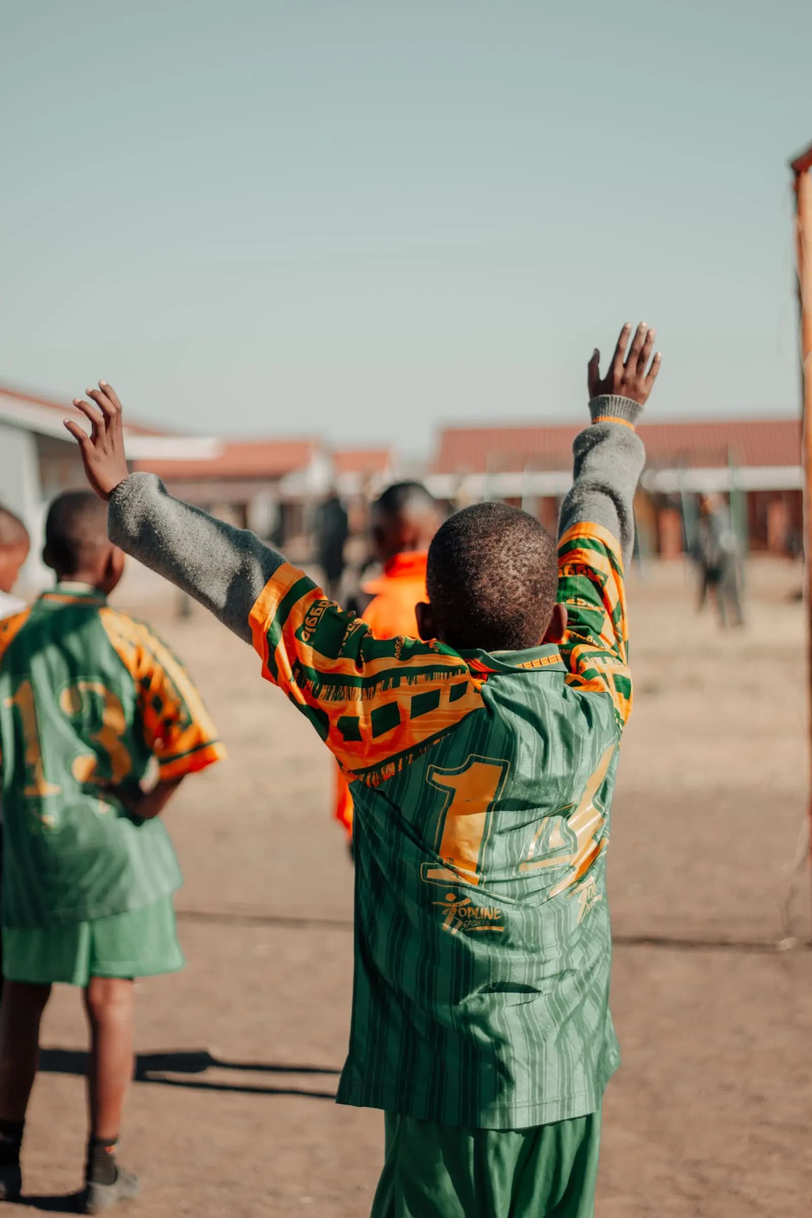Pupils cheering during a football match